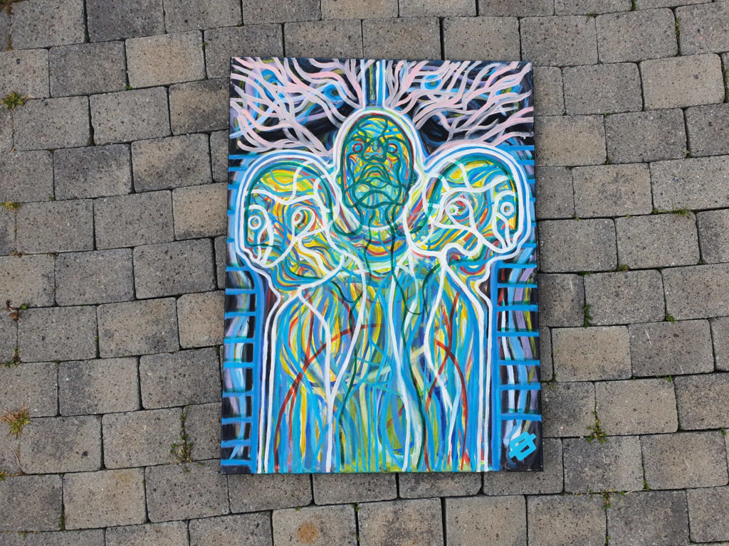 A picture of the artwork called Magnolia by Bjørn Eirik Østbakken. It shows a conjoined twins where on of them has hang it self from an Magnolia tree and the two other stare off into the distance.
